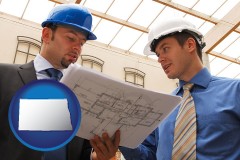 north-dakota map icon and two architects reviewing blueprints